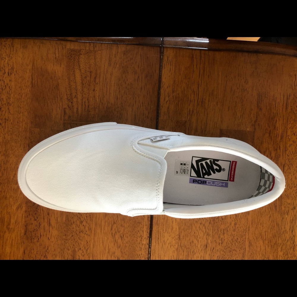 Mens 10.5 white slip on vans, never worn, new in box